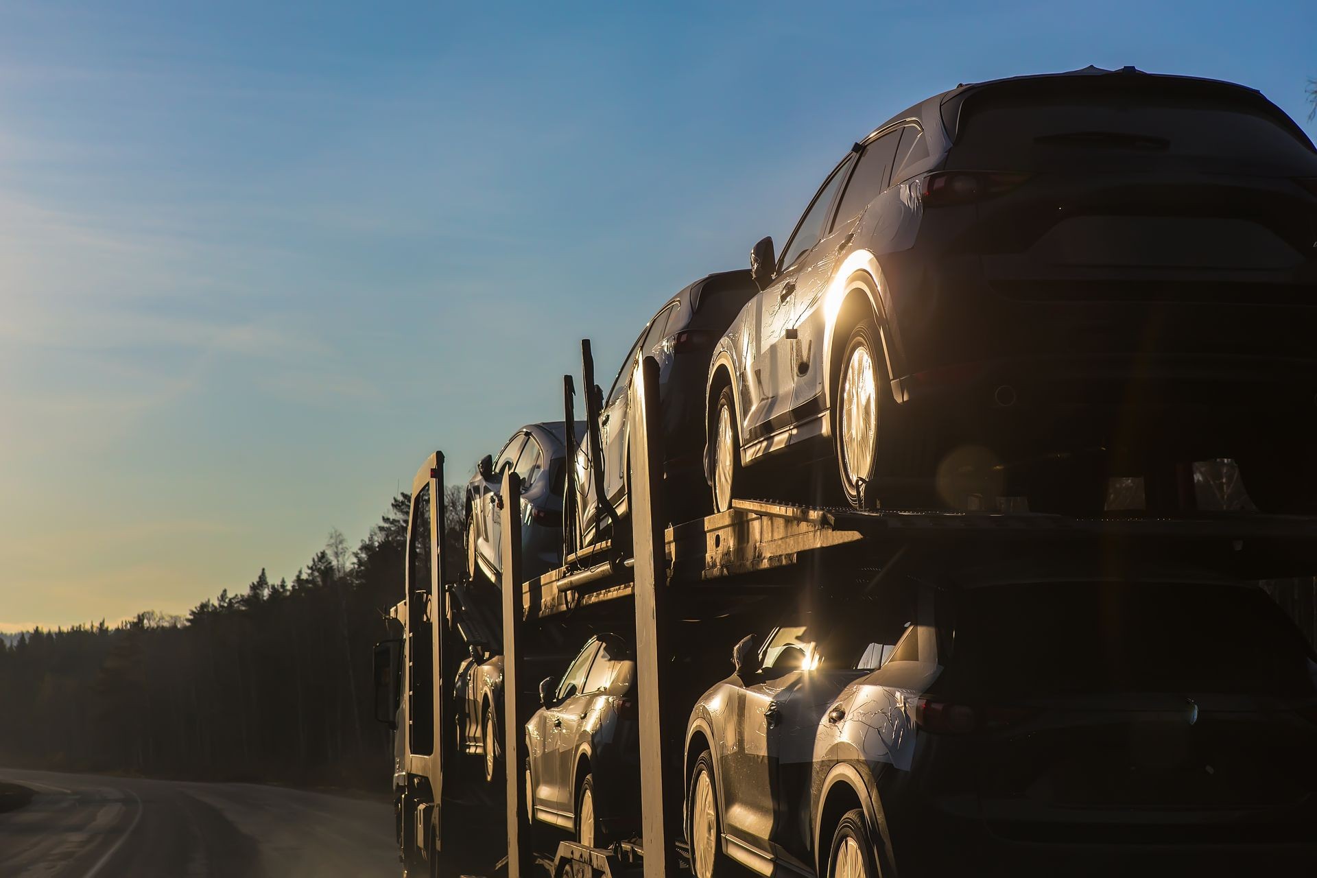 transportation of car on semi-trailer on country highway